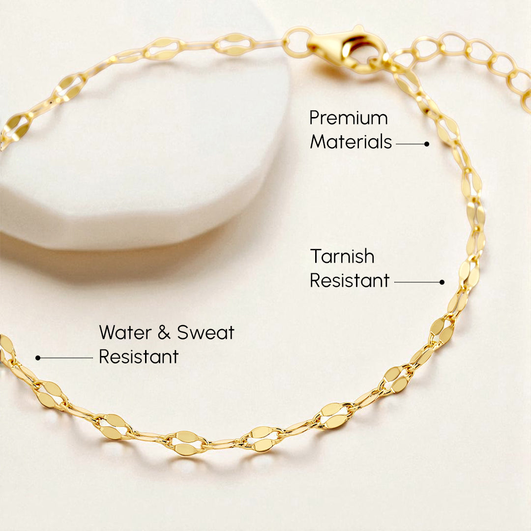 Gold bracelet on a white background with text highlighting features