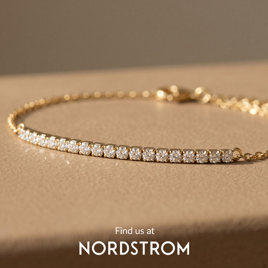 diamond bar bracelet with a gold chain and the nordstrom logo