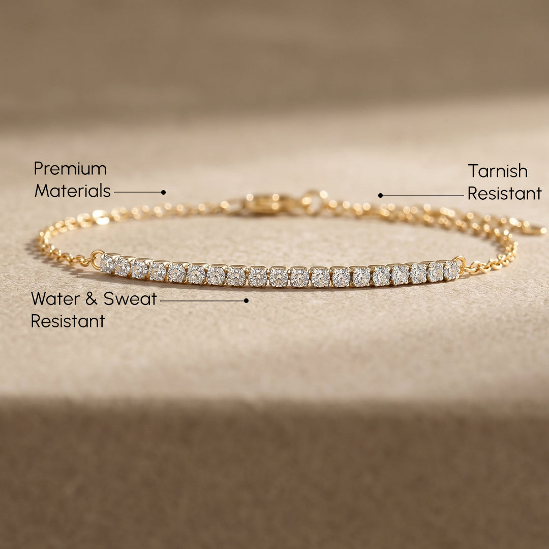 diamond bar bracelet with a gold chain flat lay image with value proposition text