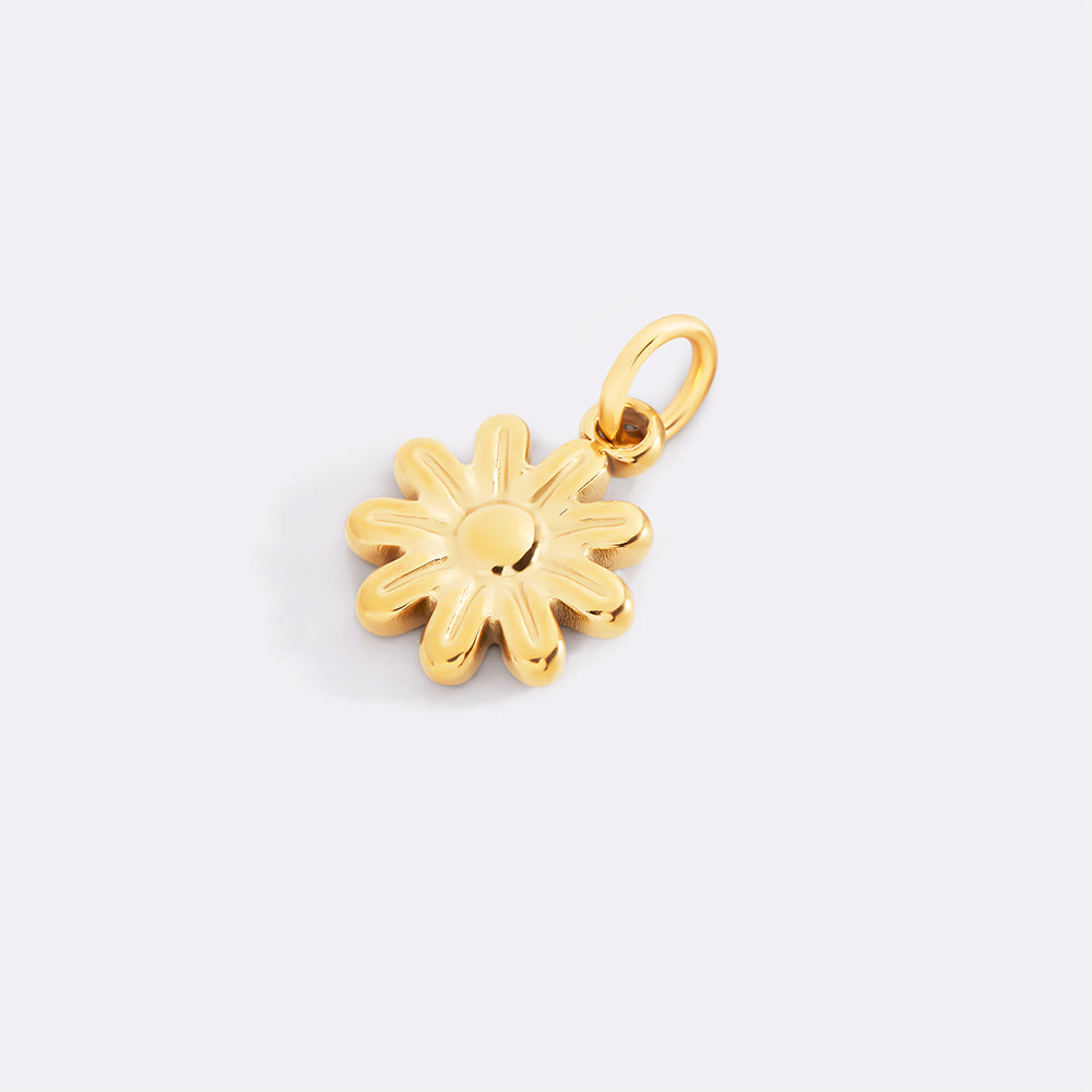 Gold flower-shaped pendant on a light gray background