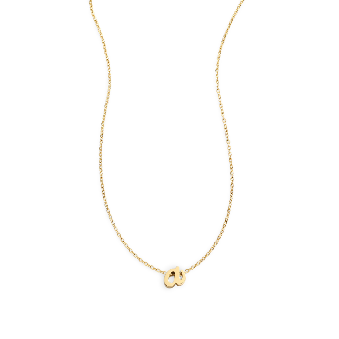 Gold necklace with a small pendant on a light gray background