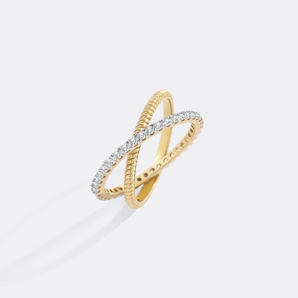 Gold ring with diamond accents on a white background