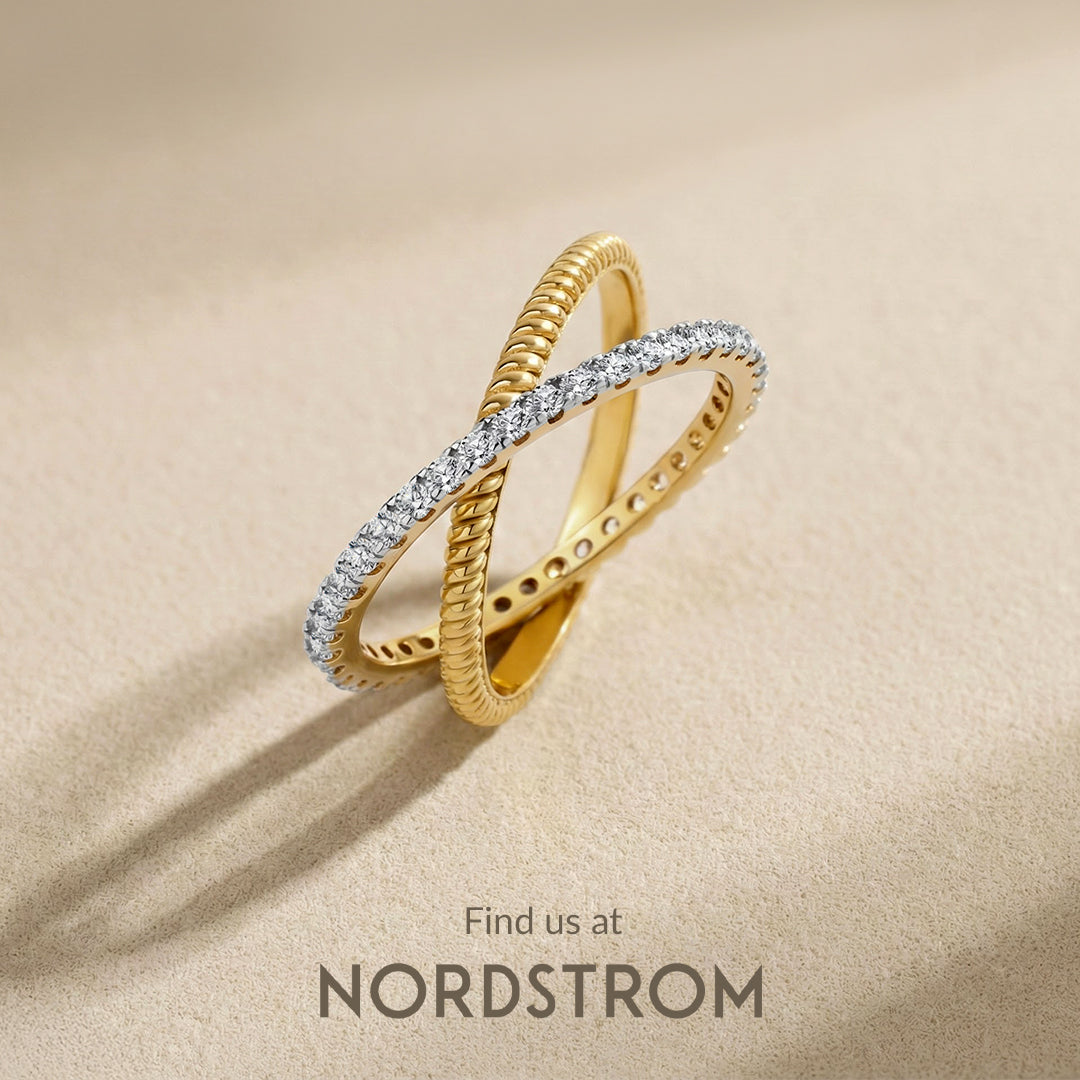 Gold ring with diamonds on a beige background, Nordstrom branding visible