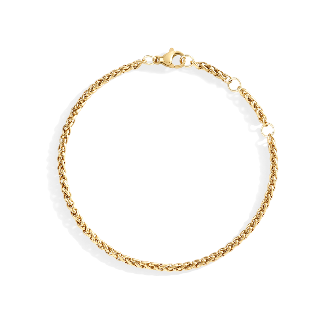 Gold chain bracelet on a white background