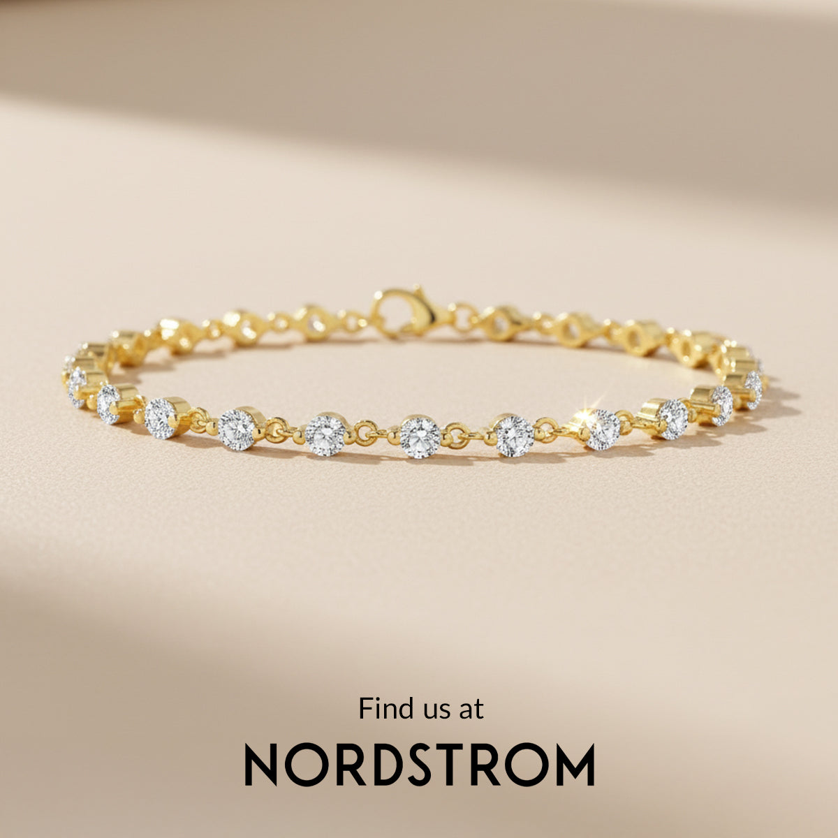 Gold bracelet with diamonds on a beige background, Nordstrom branding visible.
