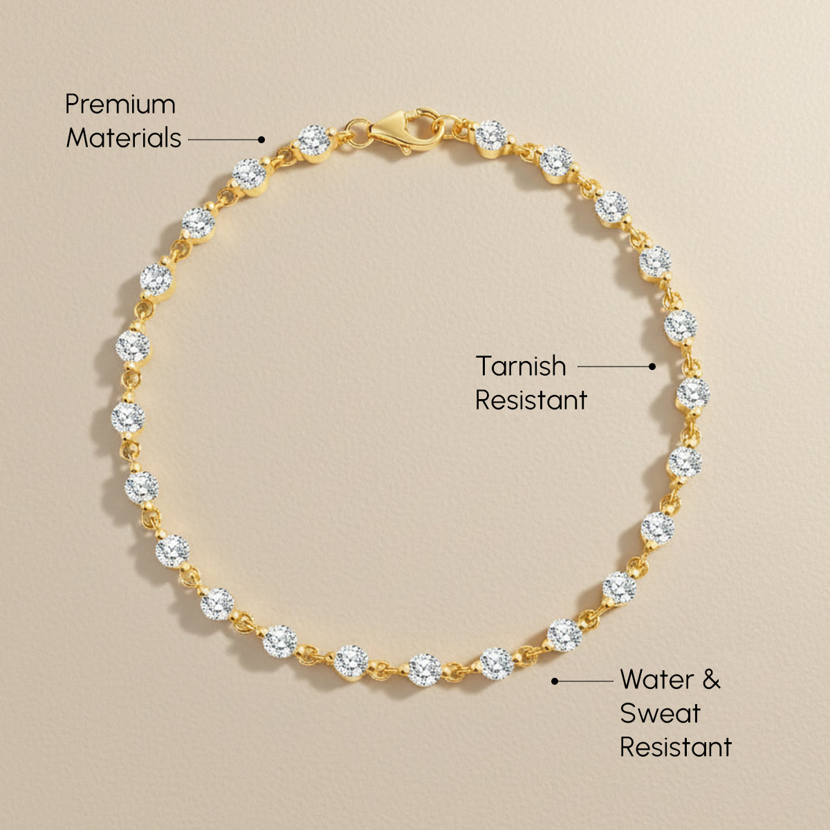 Gold bracelet with clear stones on a beige background, labeled for material quality and features.