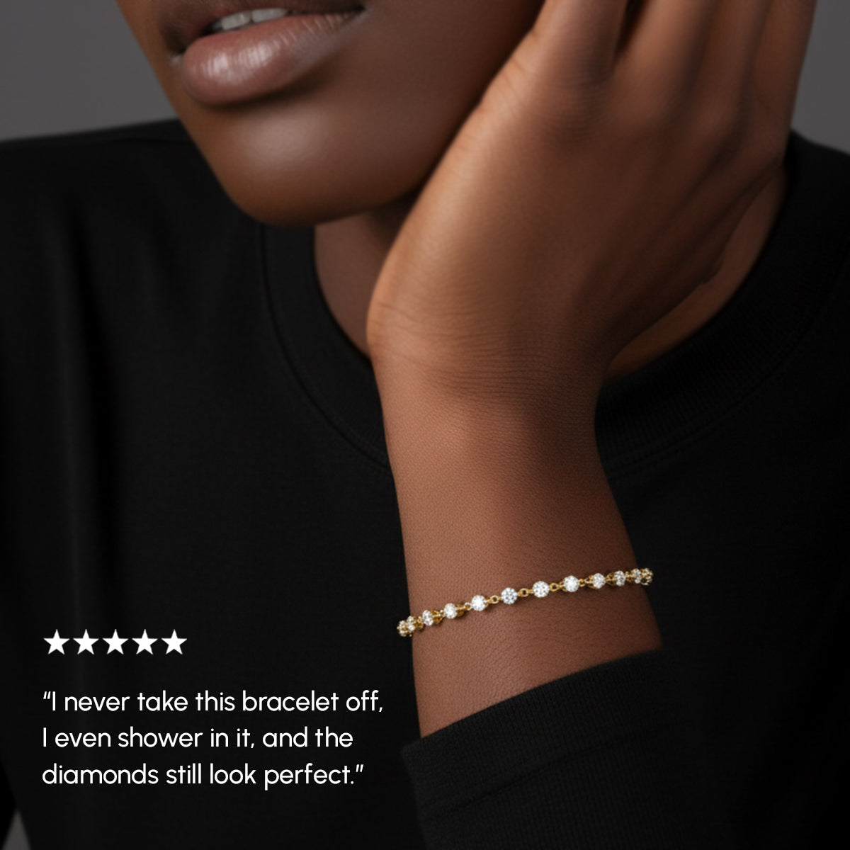 Woman wearing a gold bracelet with a quote about its durability.