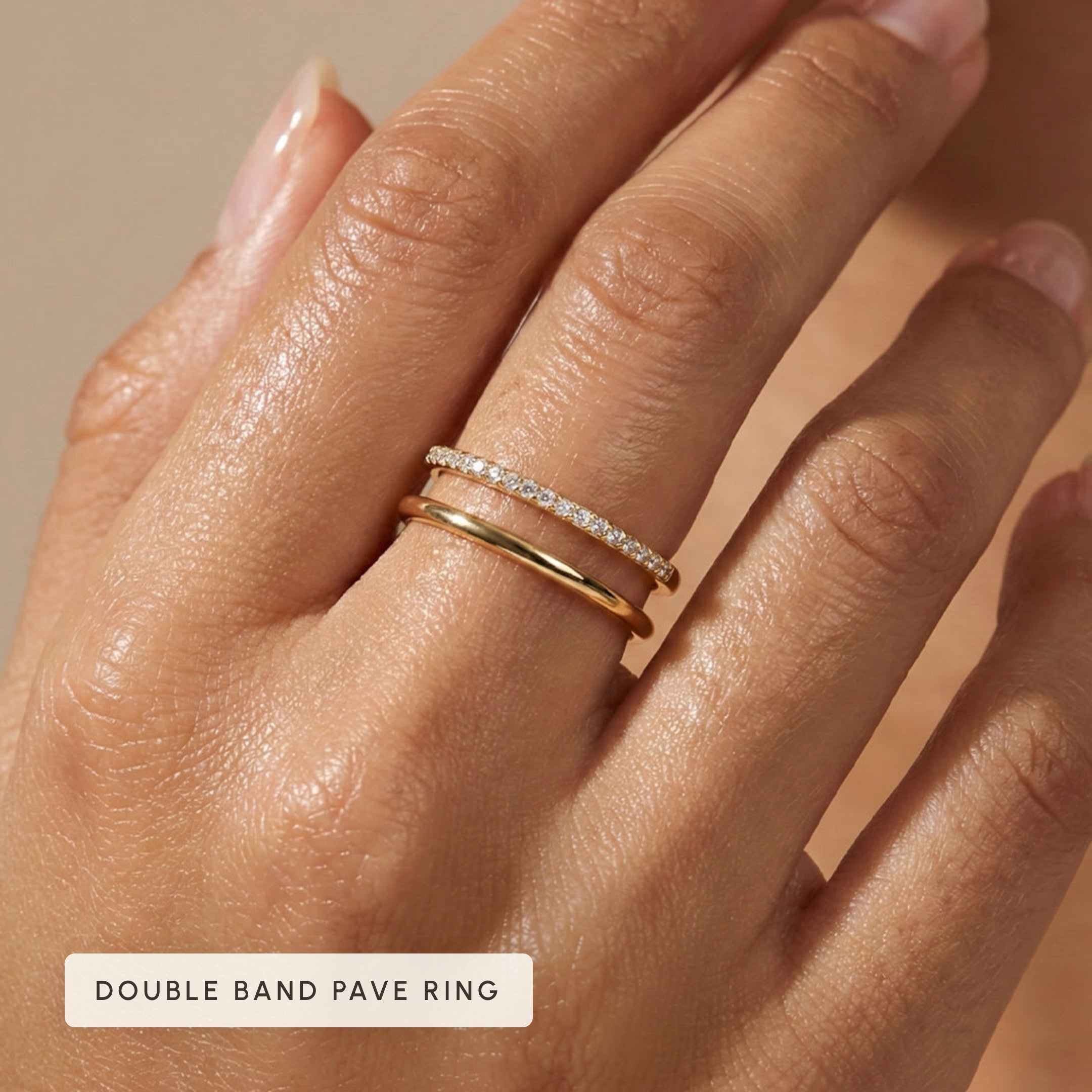 Double band pave ring worn on model's hand