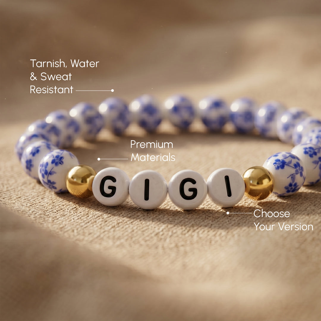 Bracelet with 'GIGI' beads on a textured surface