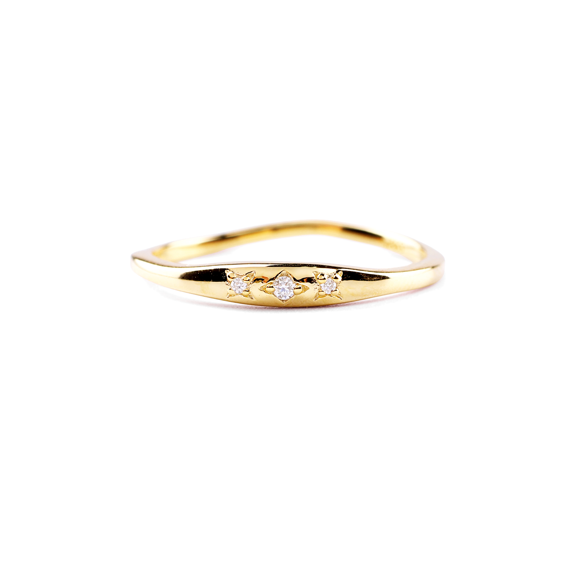 A gold-colored ring with a band width, featuring a central moissanite diamond and star motifs on a black background.