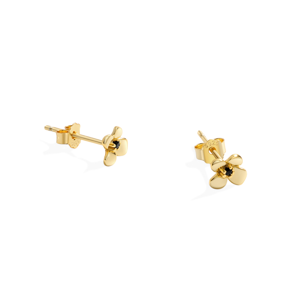 Pair of gold stud earrings on a white background