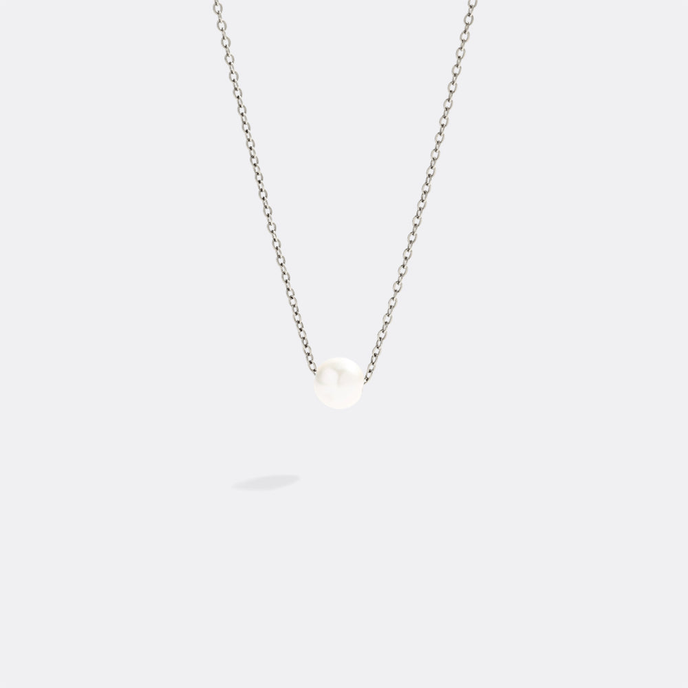 Necklace with a small heart pendant on a white background