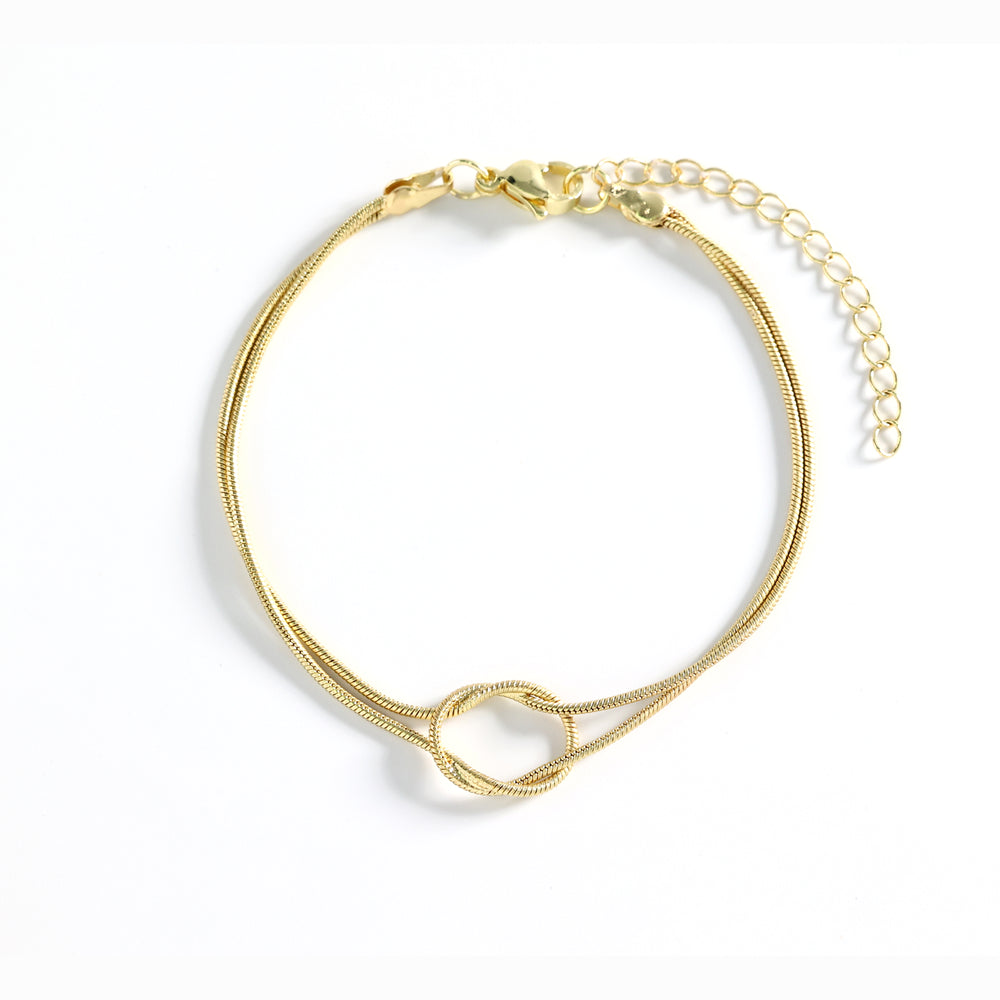 Gold bracelet on a white background