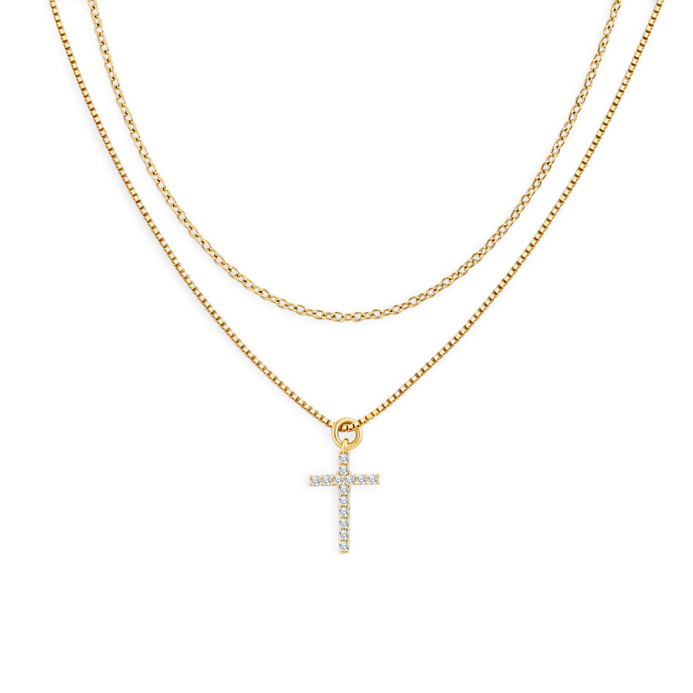 Gold necklace with a cross pendant on a white background