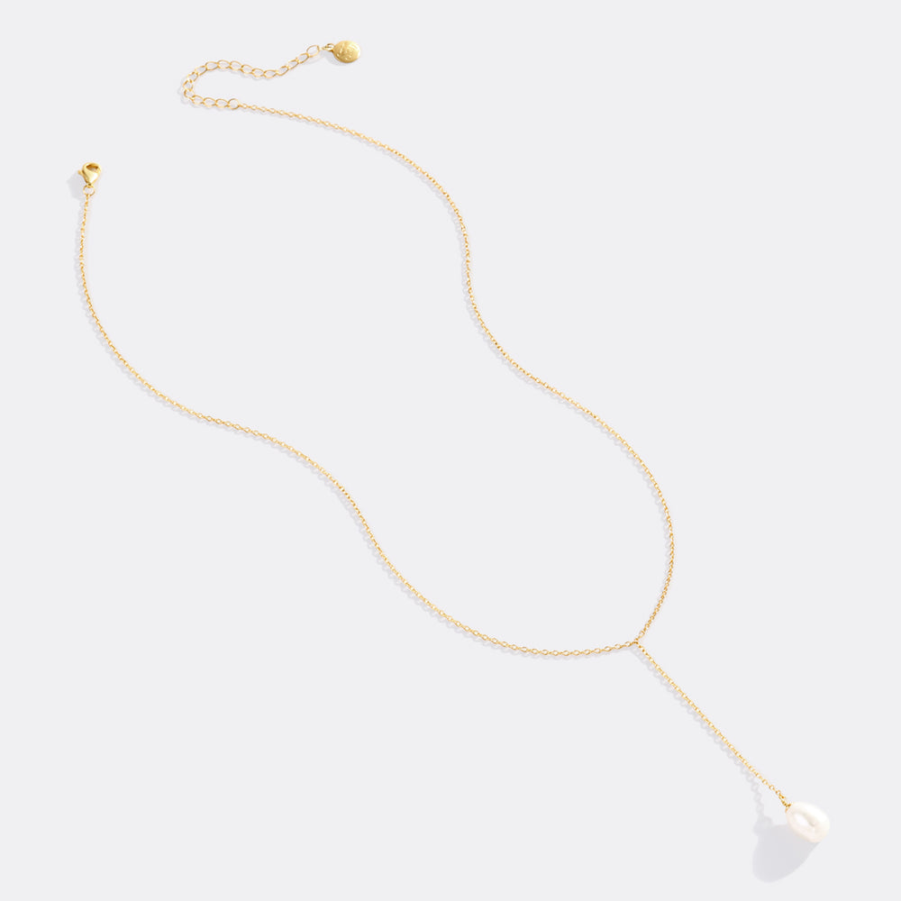 Gold necklace on a white background