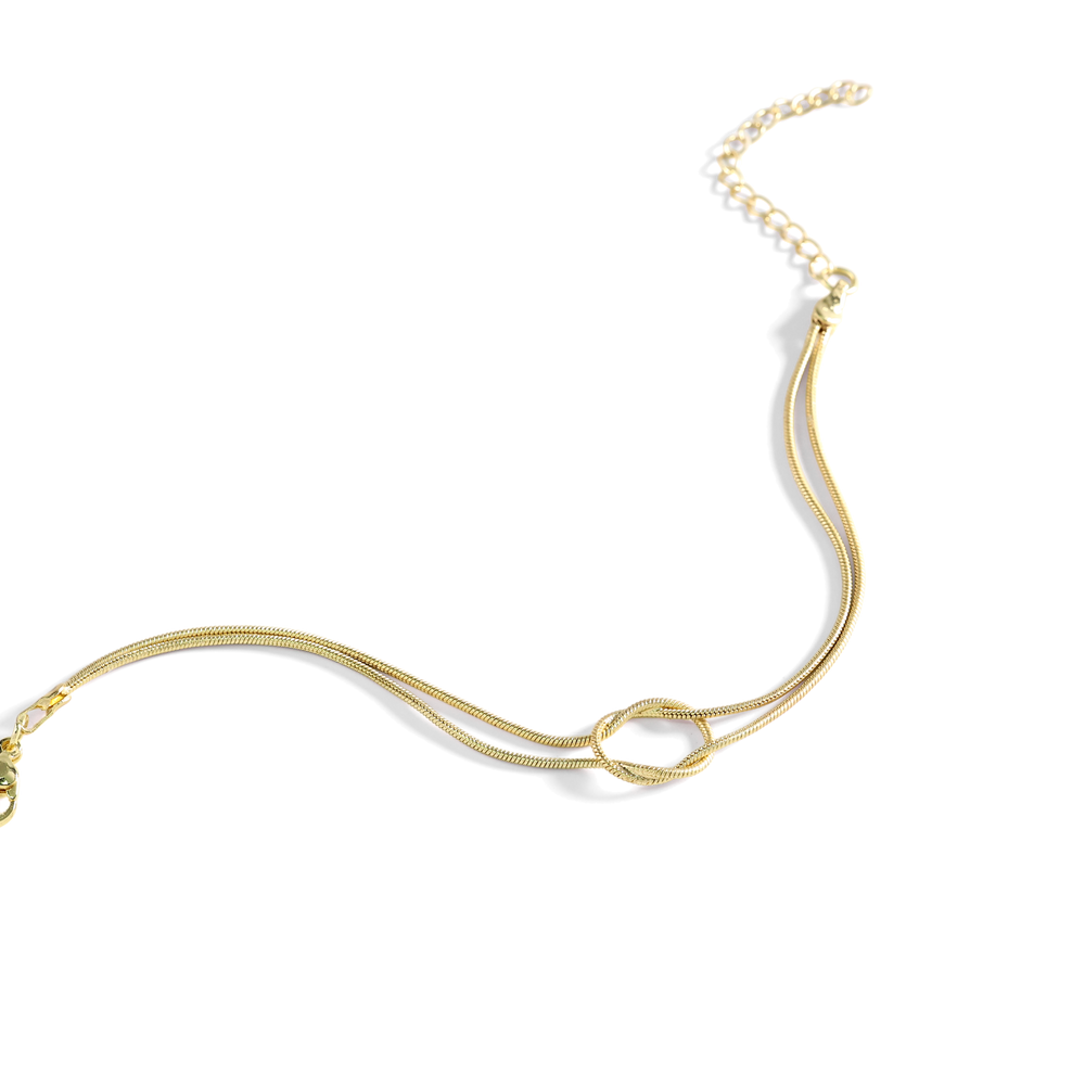 Gold necklace on a white background