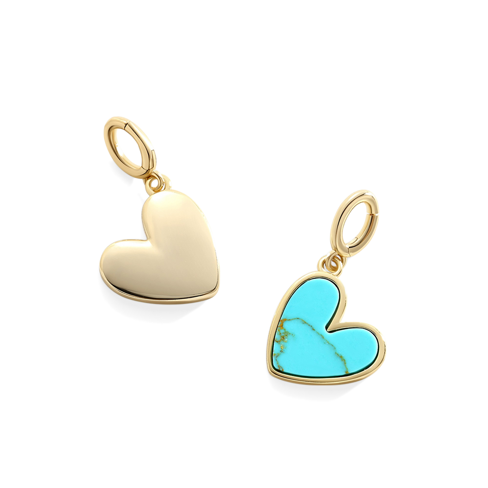 Two heart-shaped pendants, one gold and one with turquoise stone, on a white background.