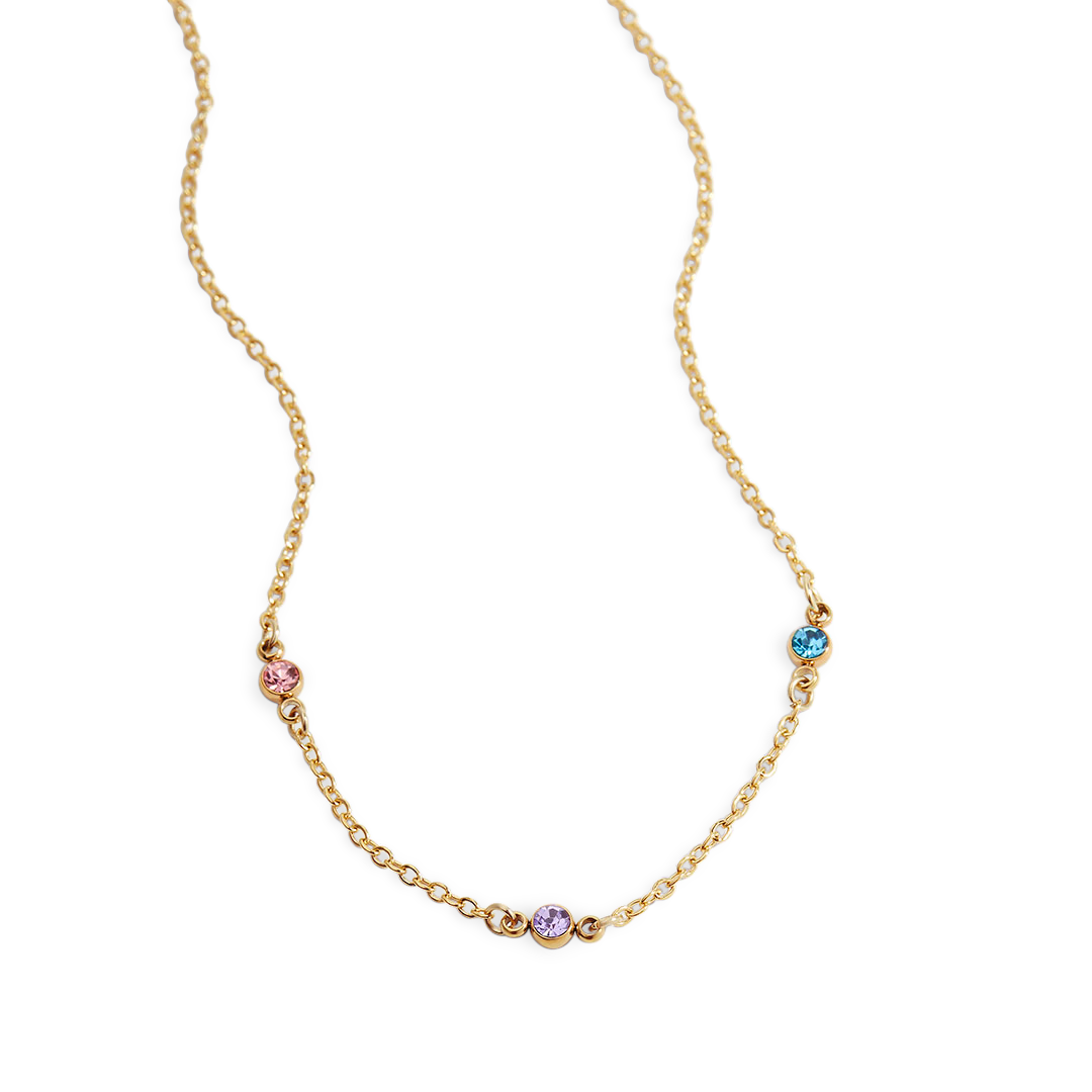 A gold-colored necklace featuring a series of small, multicolored birthstones placed along its length.