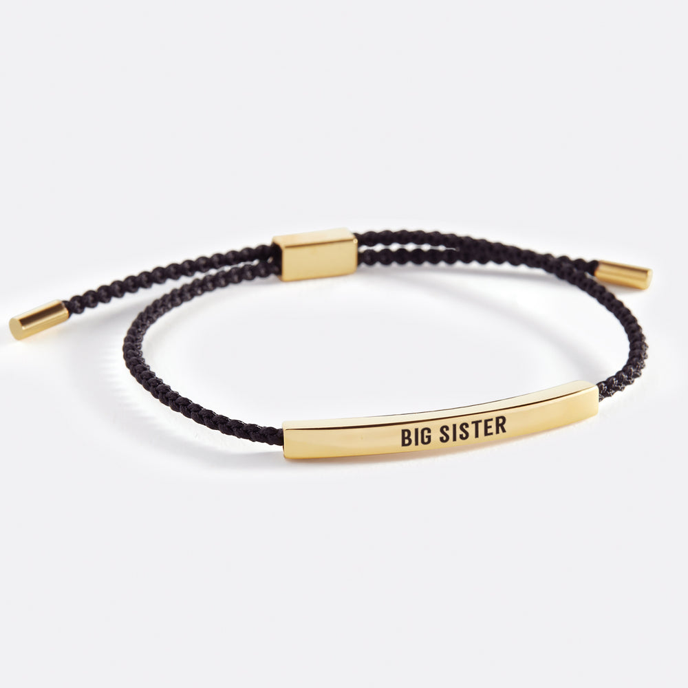 An inspirational tube bracelet with 'BIG SISTER' printed on it, presented on a white background with the text 'big sister' above the image.