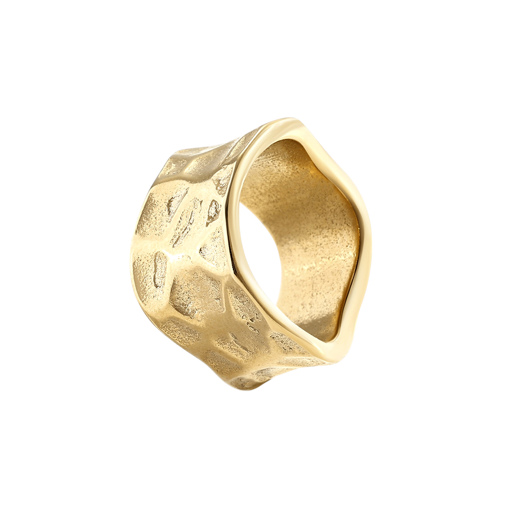 Gold ring with a textured surface on a light gray background