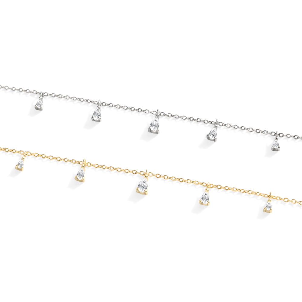 Two gold necklaces with small pendants on a white background
