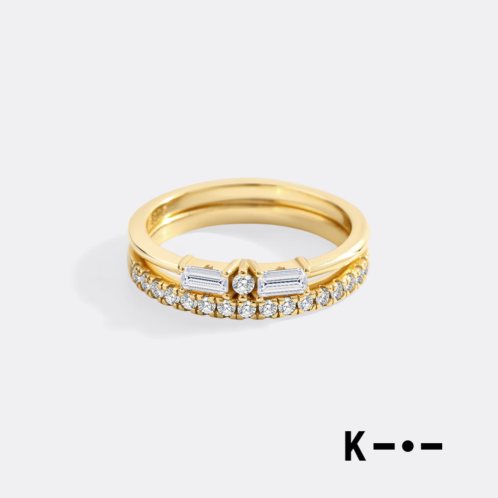 Gold ring with diamonds on a white background