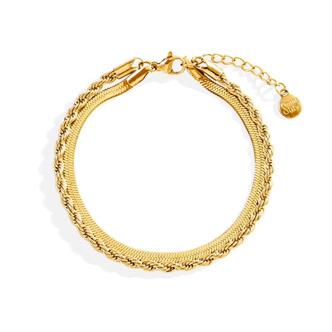 Gold bracelet on a white background
