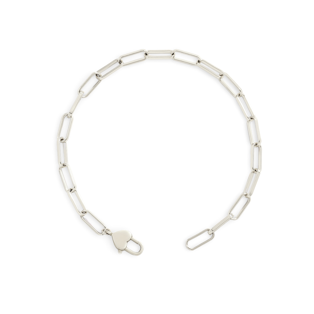 Silver chain necklace on a light gray background