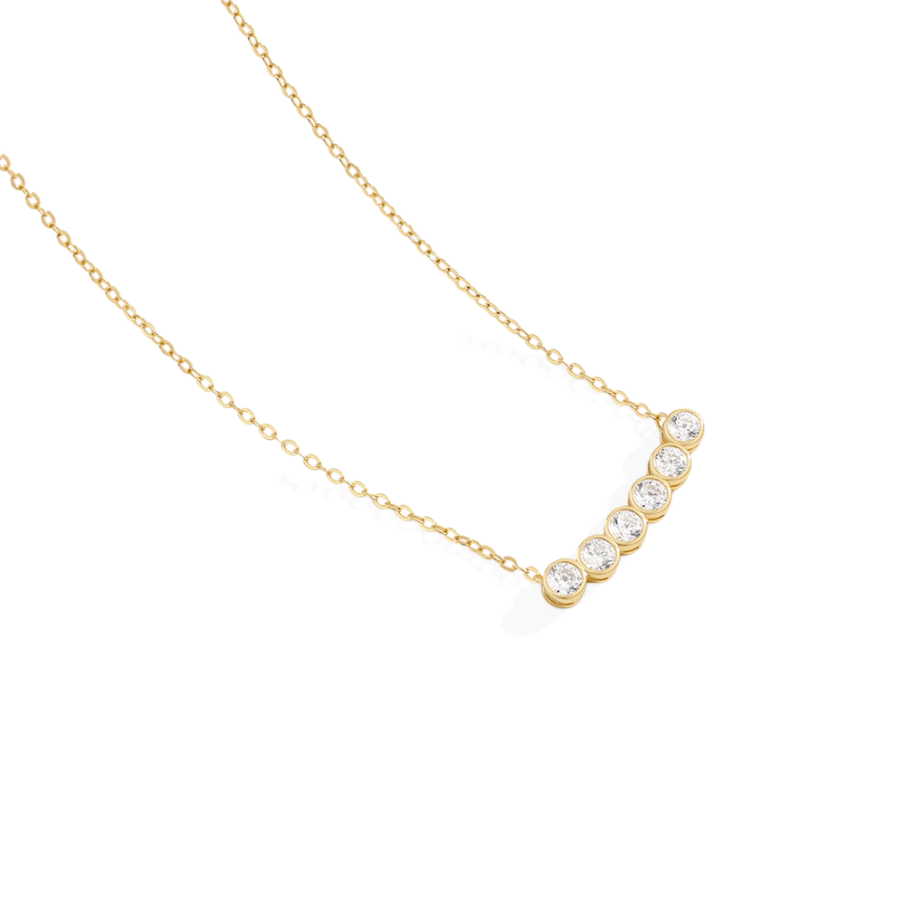 Gold necklace with small diamonds on a white background