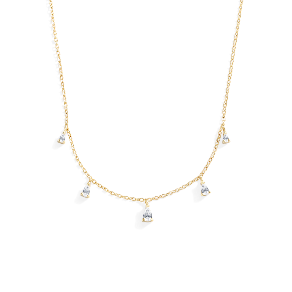 Gold necklace with small pendants on a white background