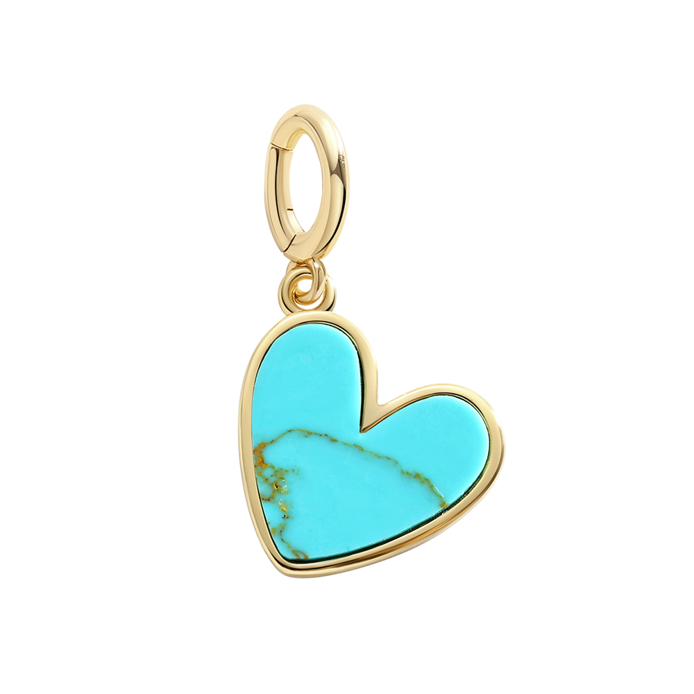 A gold heart-shaped charm with a mint green natural stone inset, designed with a hinge clasp.