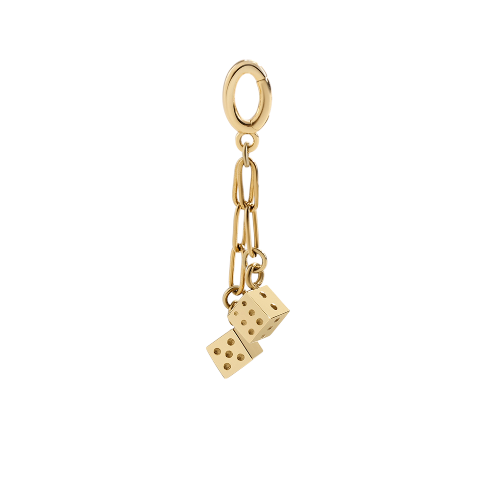 Gold charm with a dice on a white background