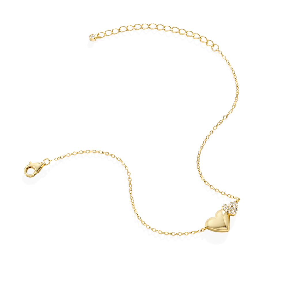 Gold bracelet with a heart-shaped clasp on a white background