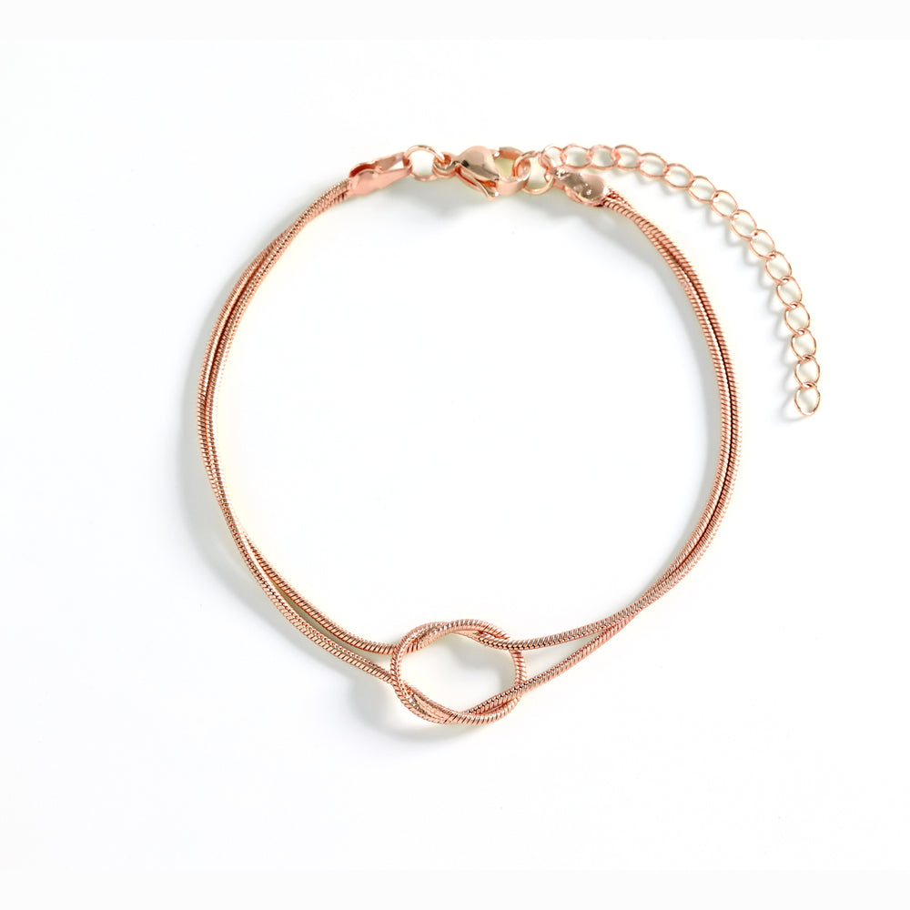 Rose gold bracelet on a white background