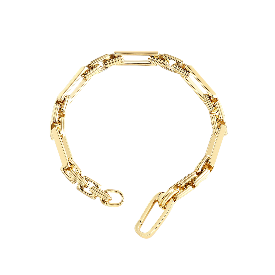 Gold chain bracelet on a light gray background