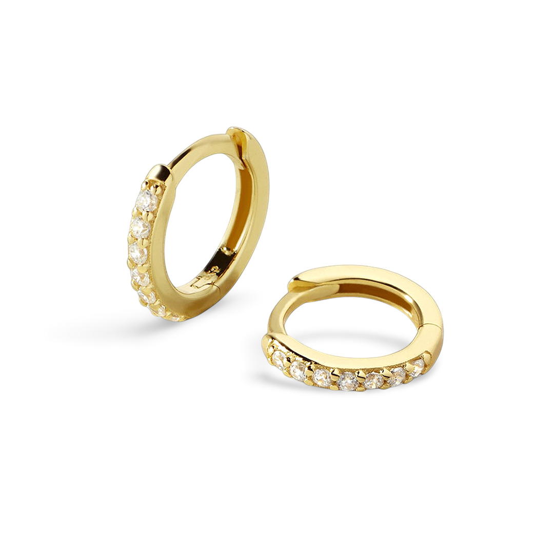 Gold hoop earrings with small diamonds on a light gray background