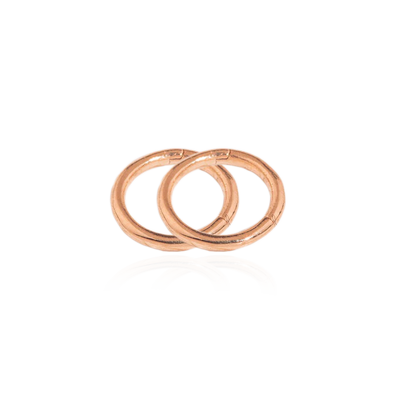 A gold-colored cartilage hoop earring with a post thickness of 16g (1.2mm).
